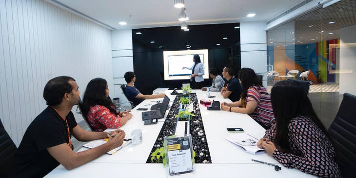 Sales and Marketing Manager briefing the sales and marketing team about the new sales plan and advertising campaigns