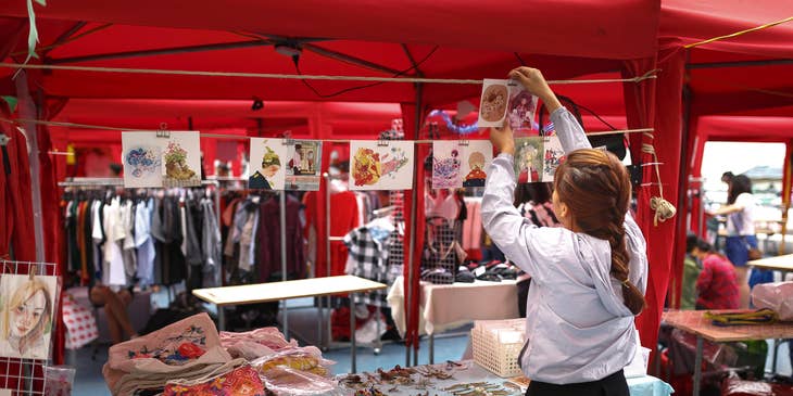 Sales promoter setting up the promotional booth for an event