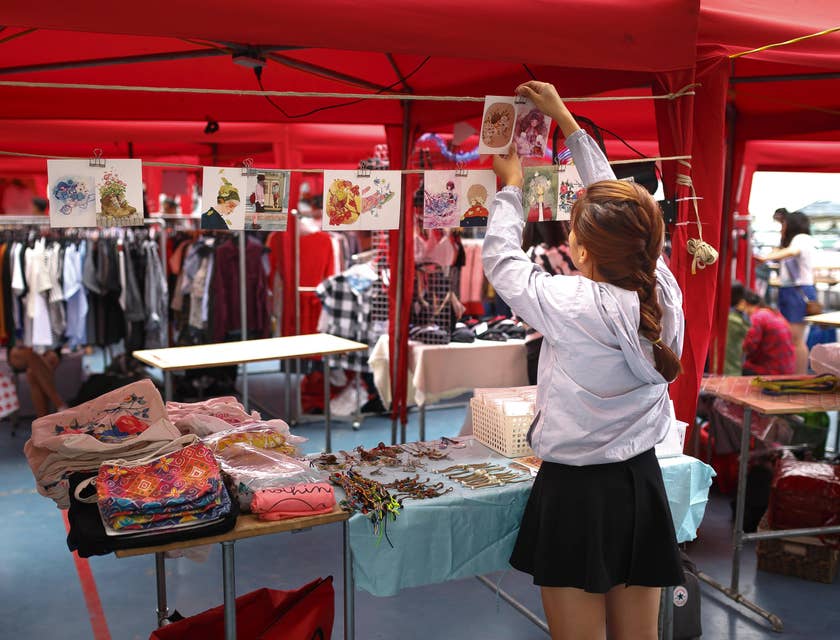 Sales promoter setting up the promotional booth for an event