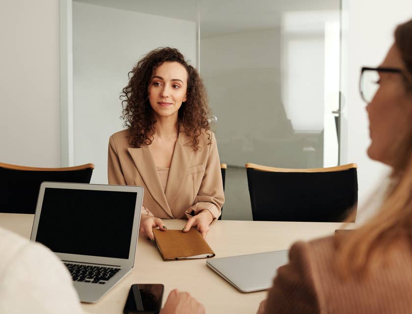 Sales Representative on a meeting answering clients' questions about the products and services of the company
