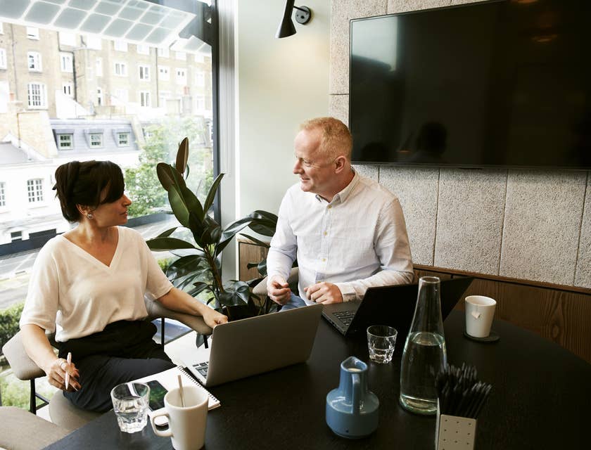 female SAP consultant discussing the customizations needed for the business' process to her client