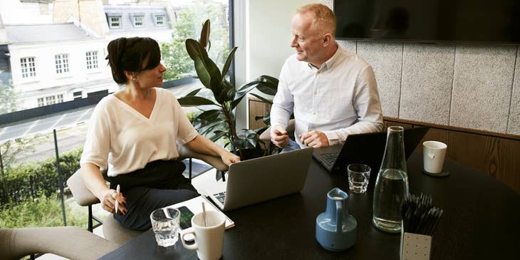 female SAP Consultant discussing the customizations needed for the business' process to her client