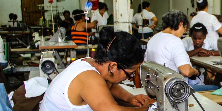 seamstress working on a sewing machine in a factory