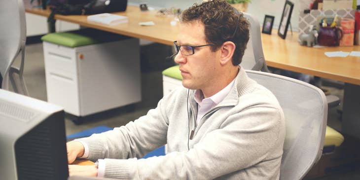 Security administrator updating the system to minimize cyber attack