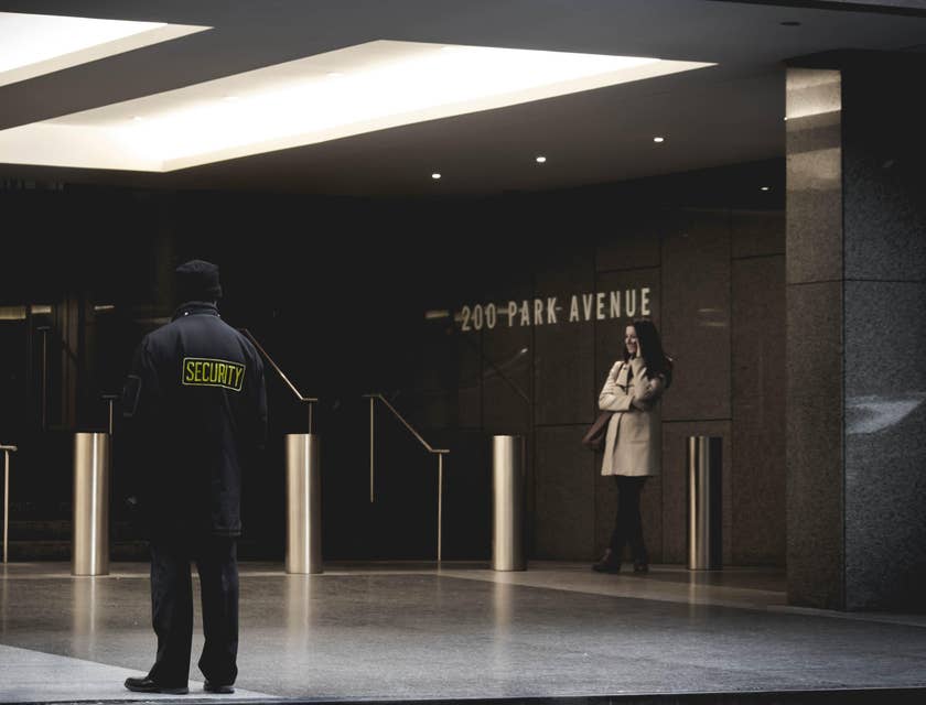Security manager standing outside a commercial building