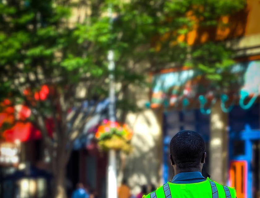 Security officer in uniform standing outside