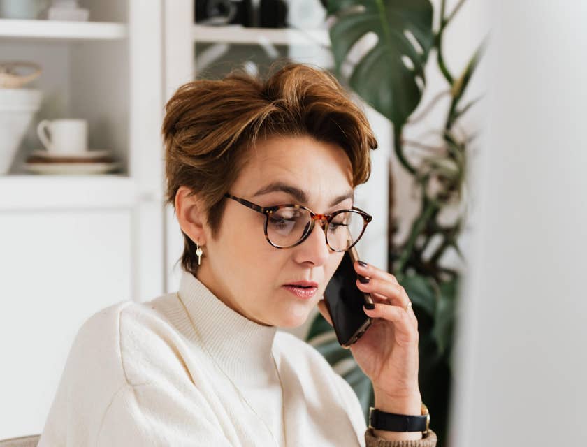 Senior account manager answering clients' questions on phone and online