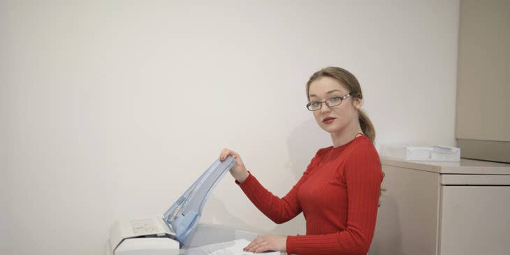 Senior administrative assistant scanning and printing documents to be distributed to the staffs