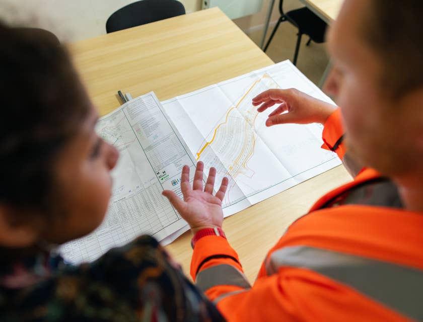 female senior civil engineer discussing with her colleague the expanse of the project