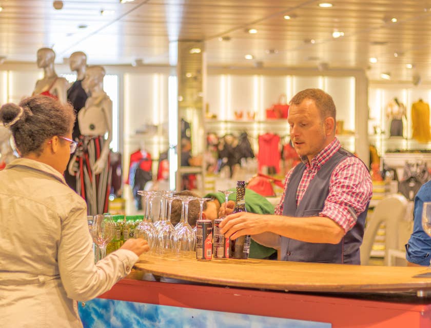 Service Clerk helping a customer on what glass to buy on what occasion