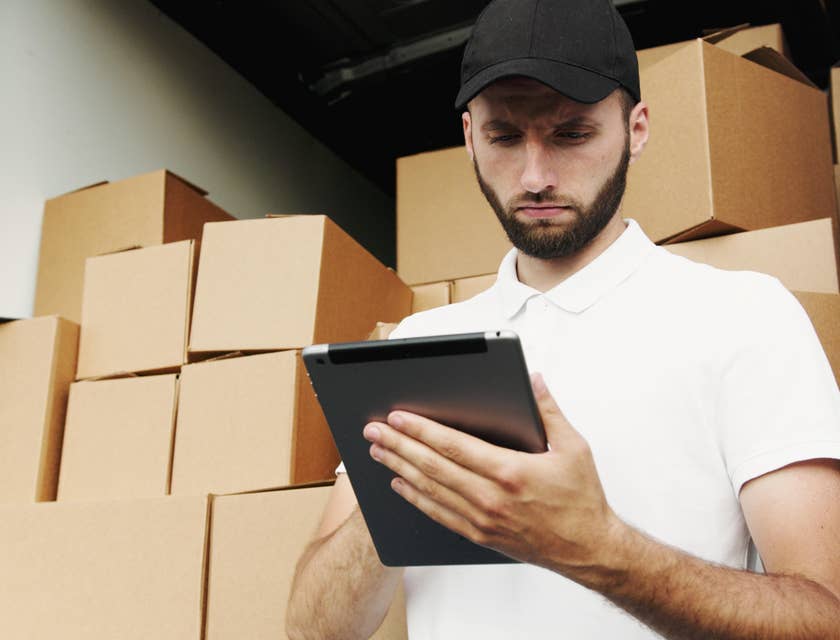 Shipping coordinator checking the shipping quote of the customers before shipping the products.