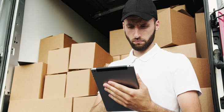 Shipping coordinator checking the shipping quote of the customers before shipping the products.