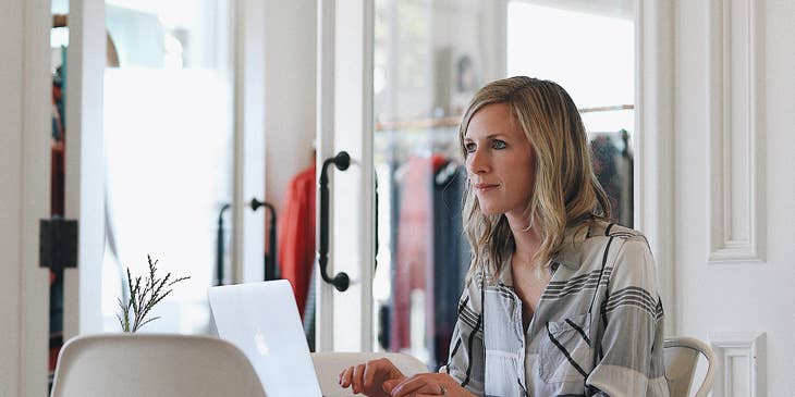 Shop manager creating work schedules for the employees