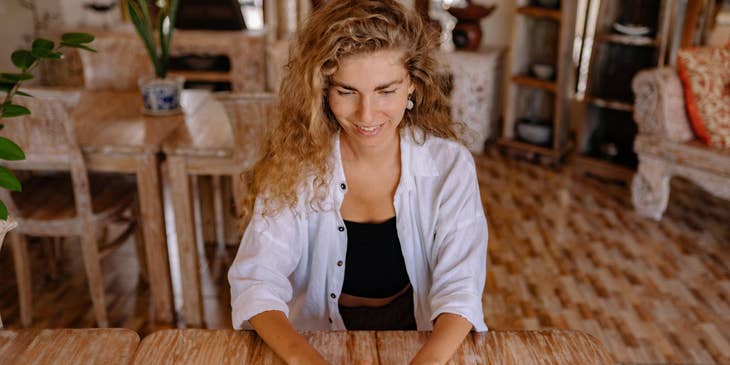 a work from home social media analyst is happy with the success of their social media campaigns
