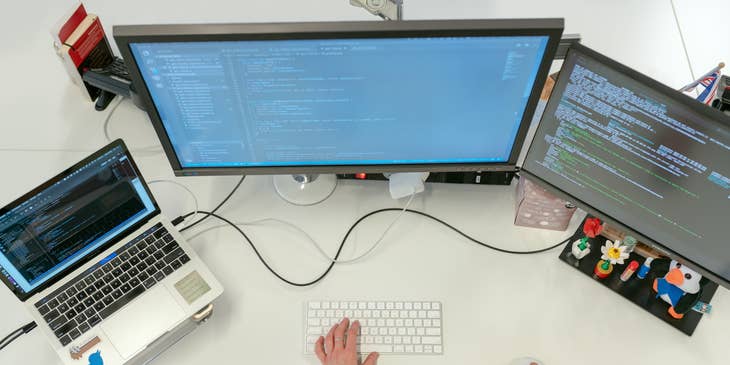 Software developer modifying software to fix errors.