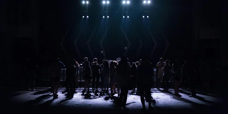 A stagehand working on a theater.