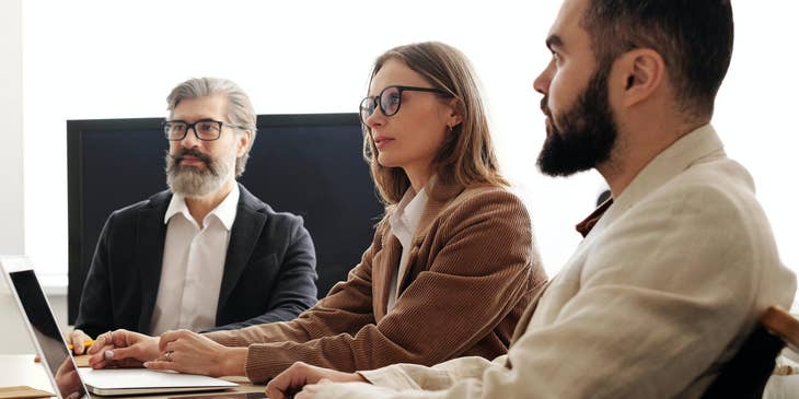 People sitting at a desk for an interview using the STAR method.