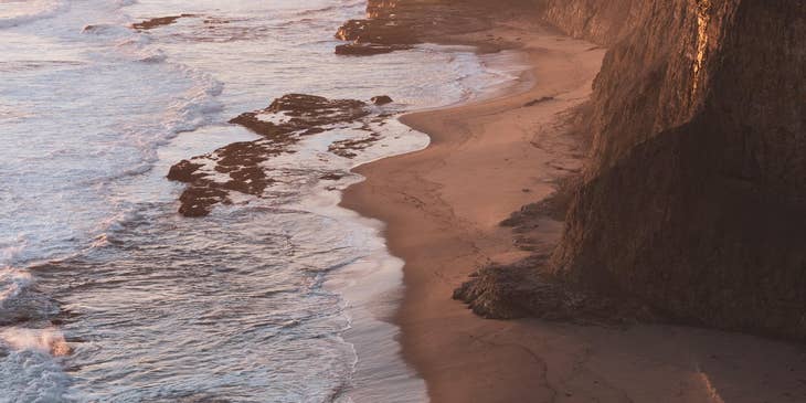 A view of the ocean at sunset in California.