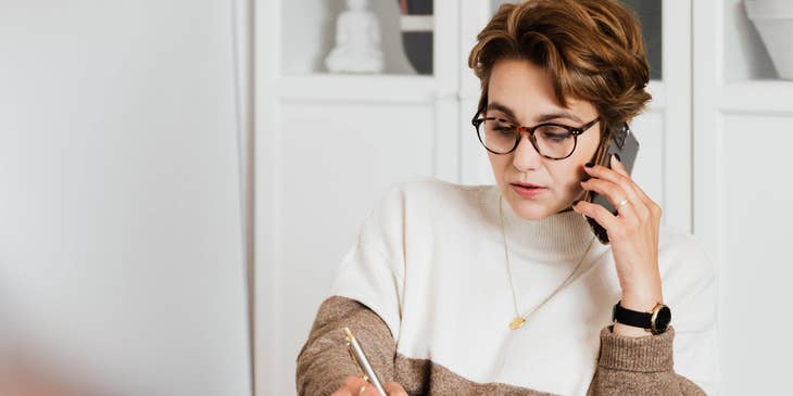 Businesswoman talking on the phone in an office.