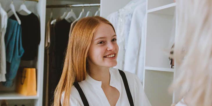Stylist giving the client some suggestions and advice on what dress to wear on what occasion