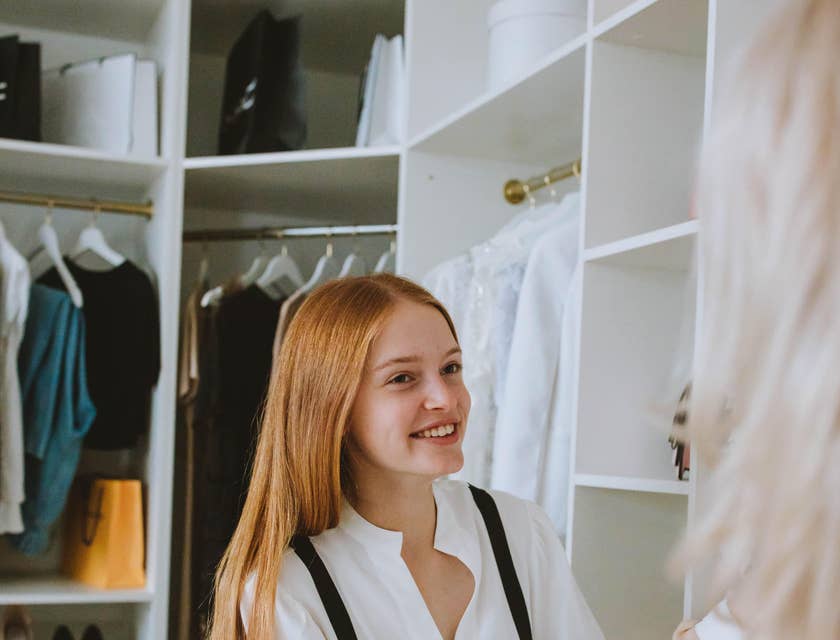 Stylist giving the client some suggestions and advice on what dress to wear on what occasion