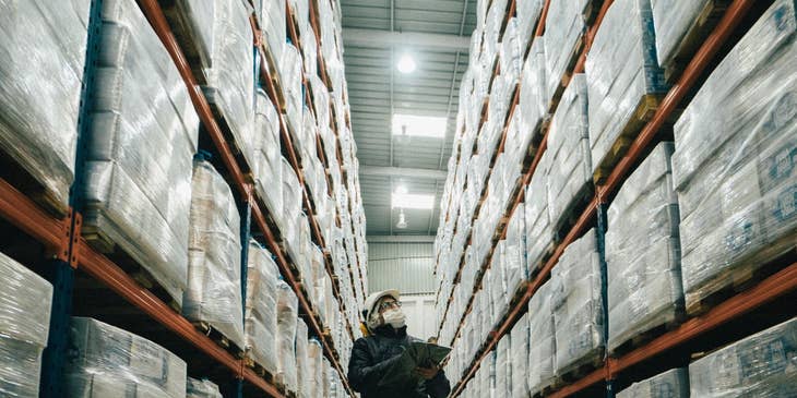Supply planner tracking the inventory on one of the warehouse