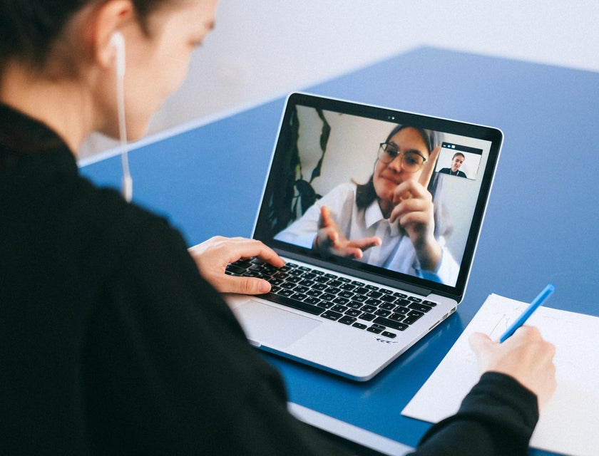 A female talent acquisition specialist conducting a video call interview with an applicant.
