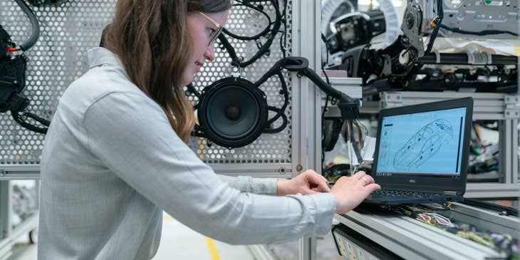Technical architect finalizes product design while making system upgrades for a new client