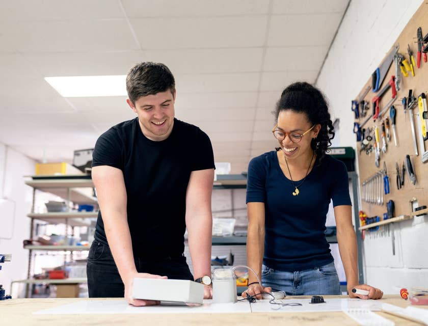 female Technical Engineer showing the product's test results to her colleague in a workshop