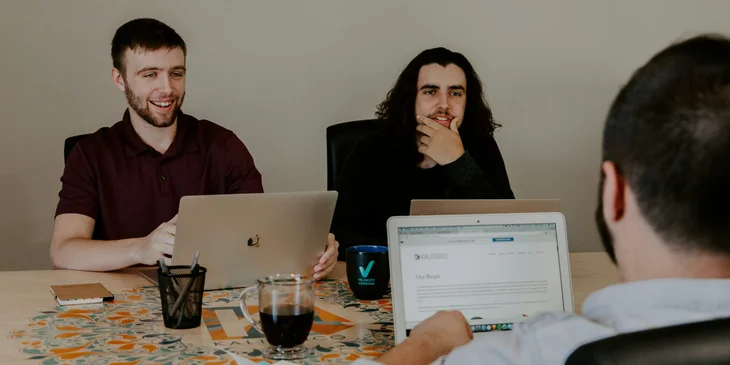 A technical lead talking in a meeting.