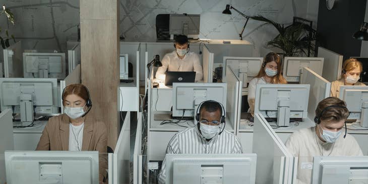Telesales representatives taking customers calls over the phone