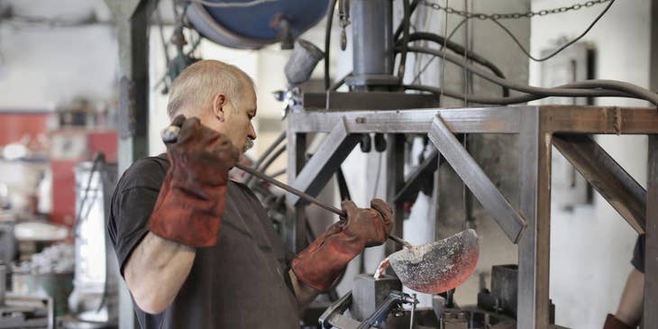 tool and die maker working in a shop