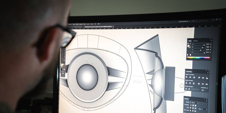 Tooling Engineer working on a design using the CAD software on his workstation