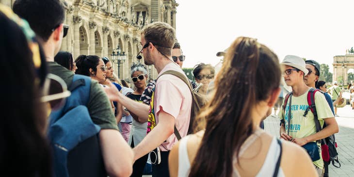 A Tour Guide discussing to a group of tourists.
