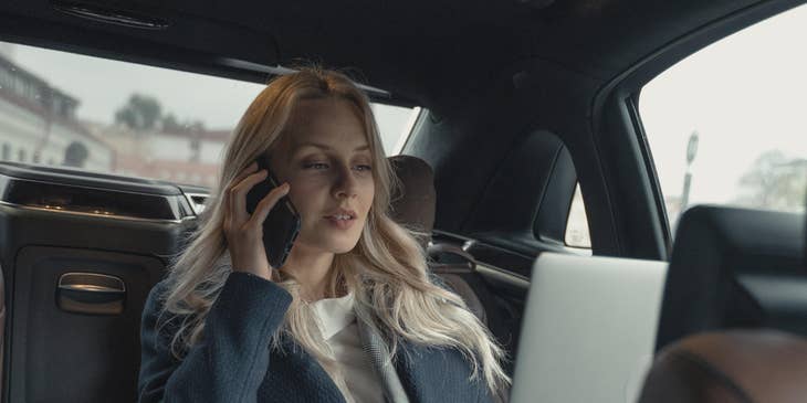 a Tour Manager checking her schedule while on the way to the next event.