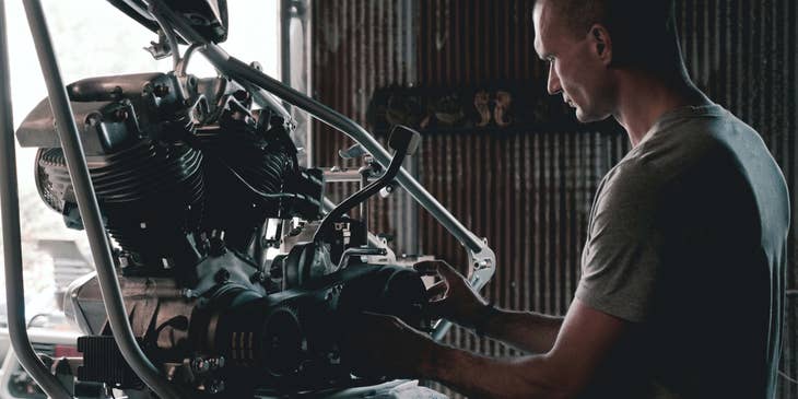 Trailer Mechanic working on an engine
