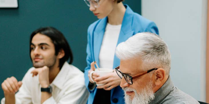 Training consultant checks updated learning materials during the meeting