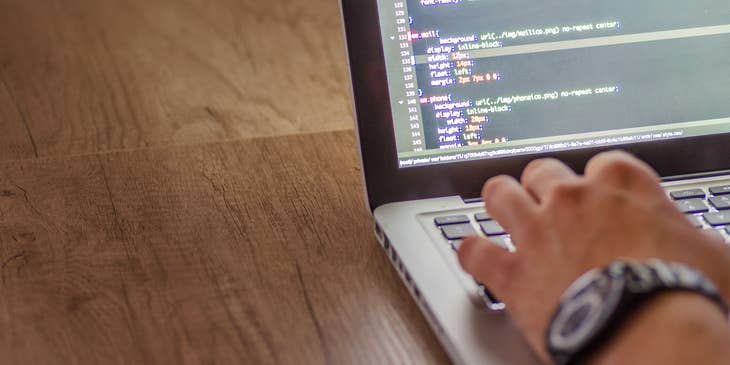 UI/UX architect is coding a website structure.
