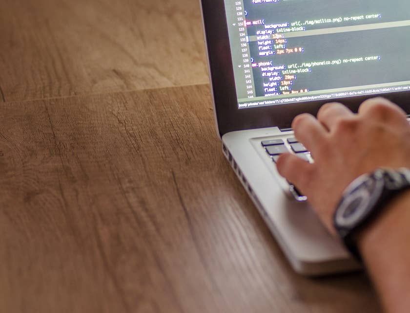 UI/UX architect is coding a website structure.