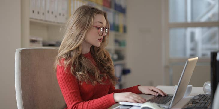 Unit Secretary updating the patients information on the computer