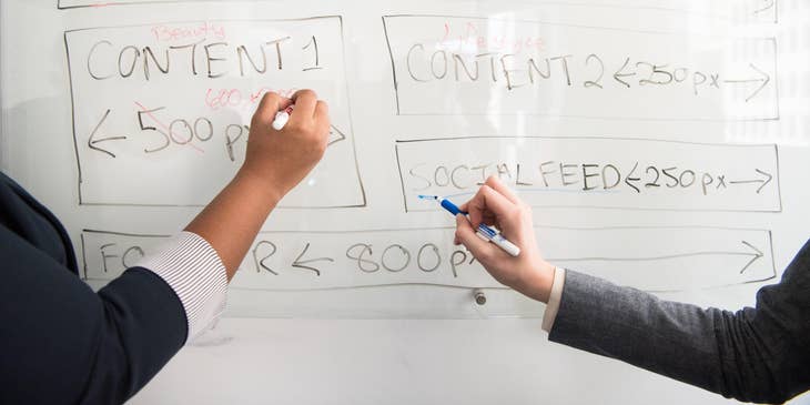 UX designer coordinating with designers to brainstorm application ideas.
