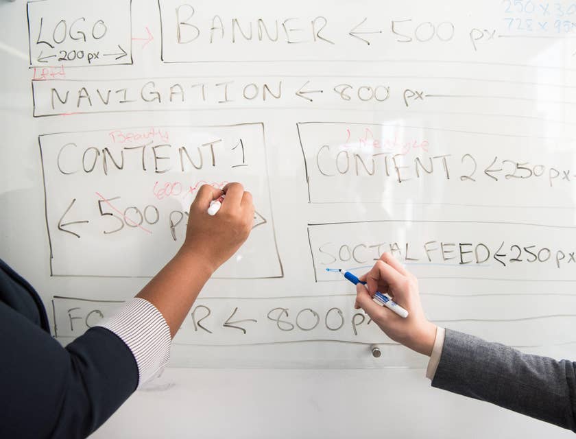 UX designer coordinating with designers to brainstorm application ideas.