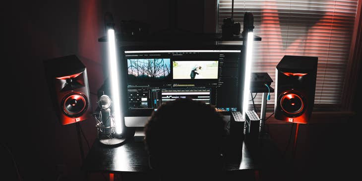 Video editor working in a dark room