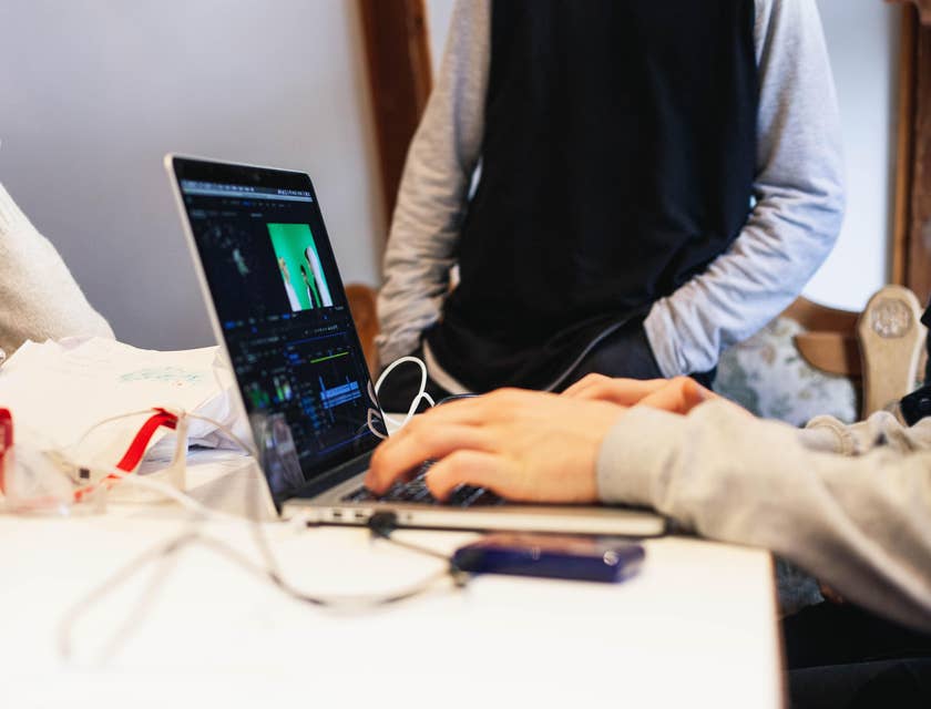 Visual Effects Artist adding effects on a scene that was recorded on a green screen