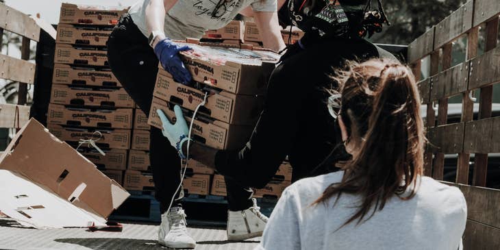 a Volunteer Manager looking over the center's incoming delivery and her team's workload