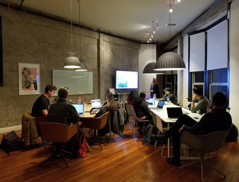 a group of engineers, developers, and their VP of engineering having a year-end meeting before taking their company vacation