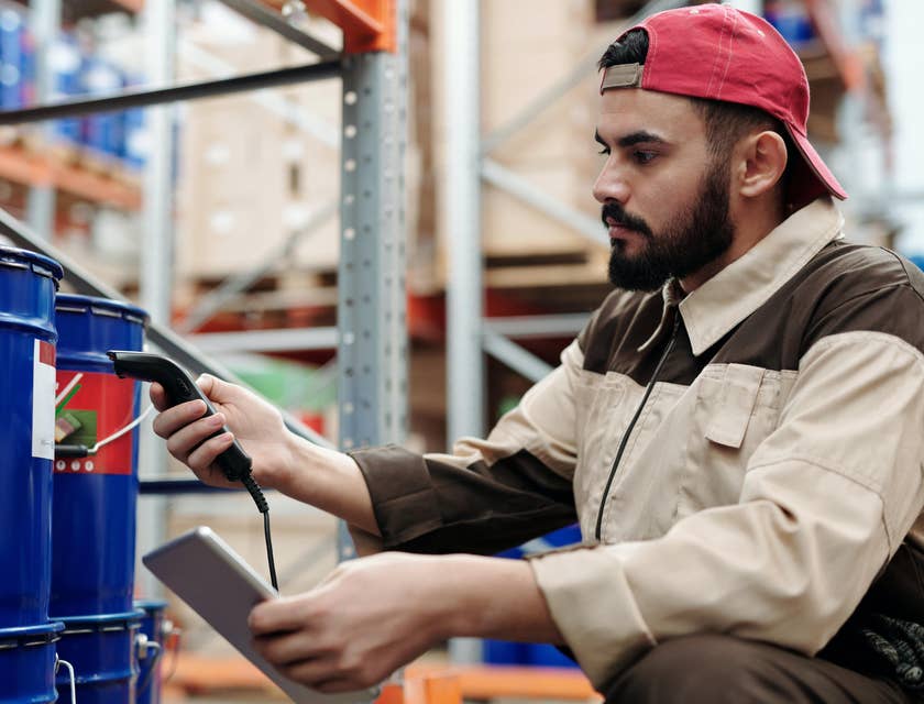 Warehouse associate checking the item before preparing it for shipment