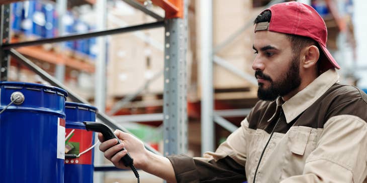 Warehouse Associate checking the item before preparing it for shipment