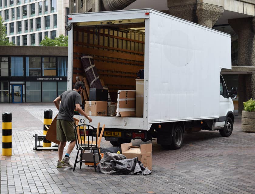 Warehouse driver loading the items to the vehicle before delivery