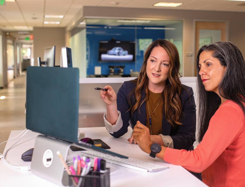 a web project manager giving updates to her superior on the progress of their current project